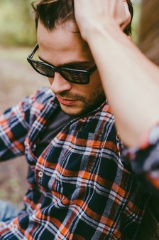 Man wearing PLANK wood framed polarized sunglasses