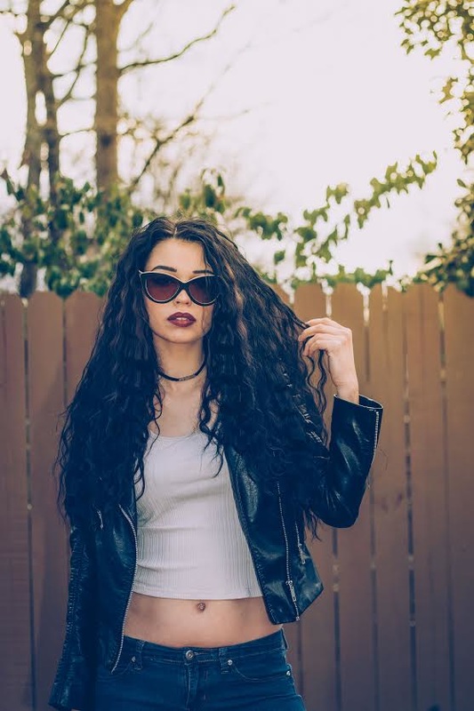 Goth girl wearing bamboo wood sunglasses